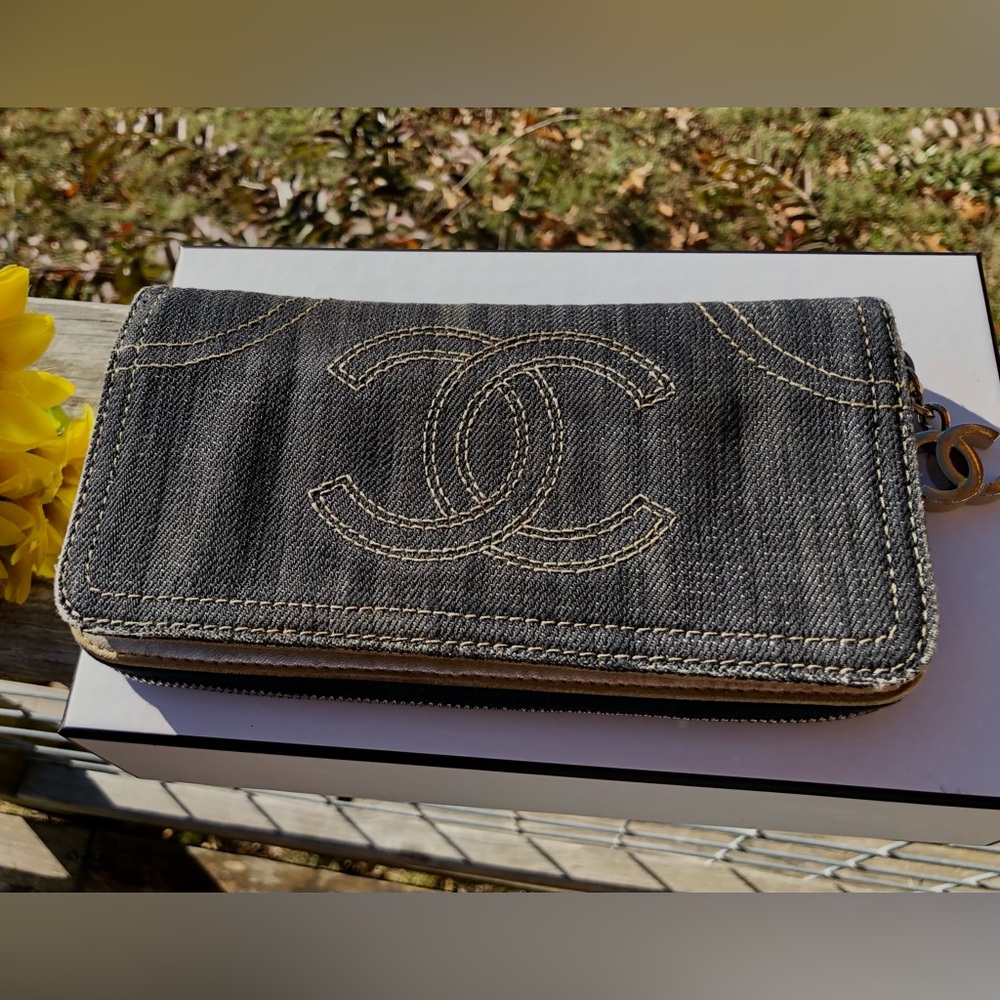 Auth Chanel dark denim zippy wallet with gold leather & CC zipper pull.